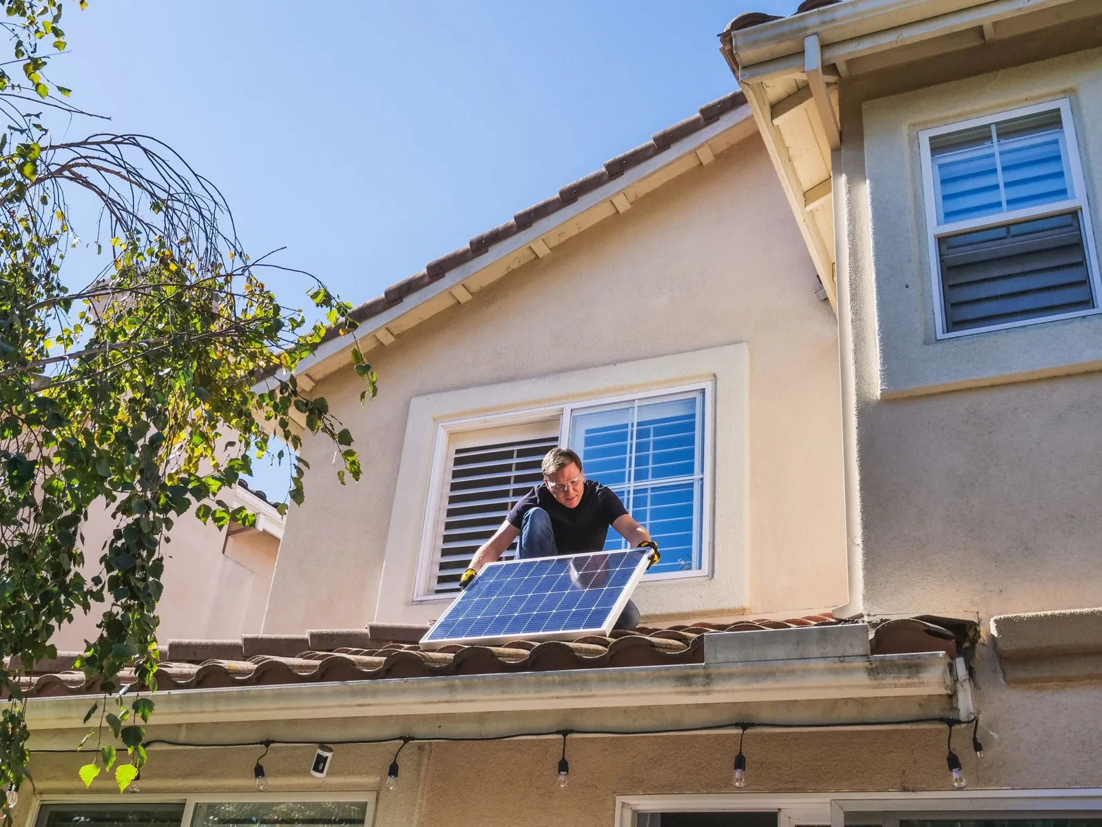A homeowner reviews solar financing paperwork before signing