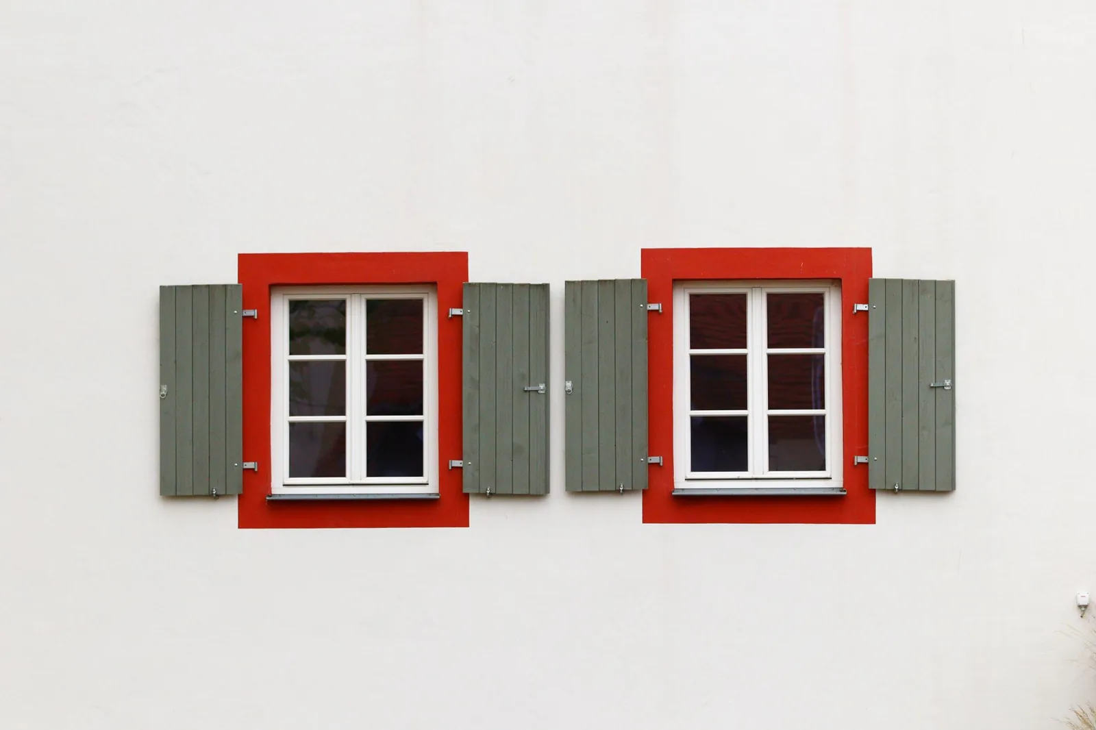 Fiberglass and wood windows carry higher materials costs but can last decades when installed correctly